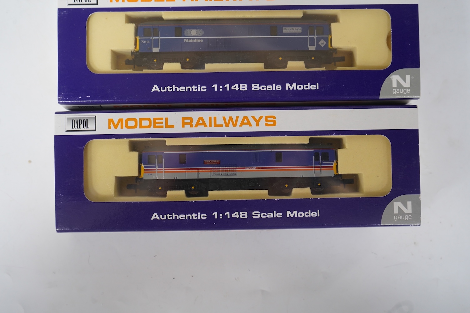 Three boxed Dapol N gauge railway Class 73 electro-diesel locomotives; 73109 Battle of Britain (ND006), 73114 Stewarts Lane (ND-021a) and 73128 (ND005). Condition - good.